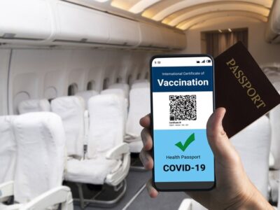 traveler-holds-vaccine-passport-certificate-show-covid-19-vaccination-status_31965-15822